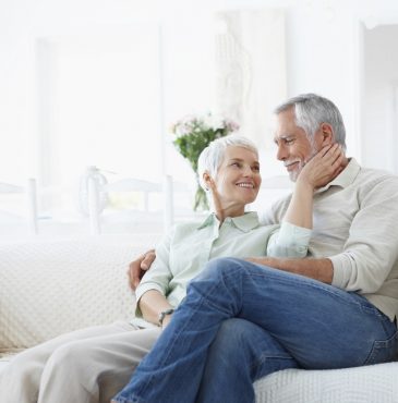 An old elderly retired couple sitting peacefully